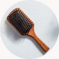 Step 1: Invigorate scalp using a paddle brush